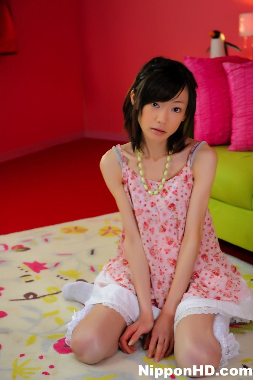 Petite Japanese girl with a pretty face models non nude in knee socks page 1