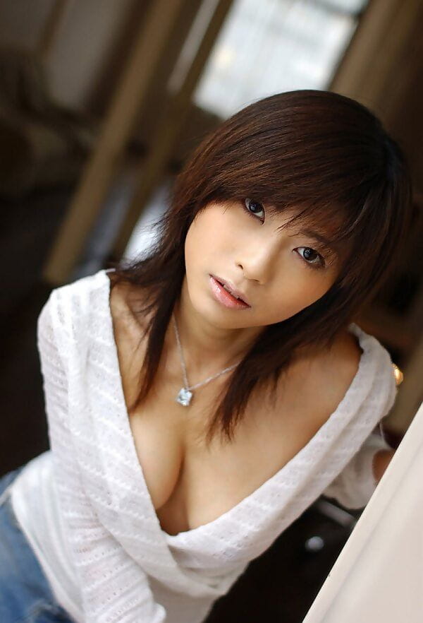 Beautiful Japanese girl Rin Suzuka lets a firm breast loose during solo action page 1