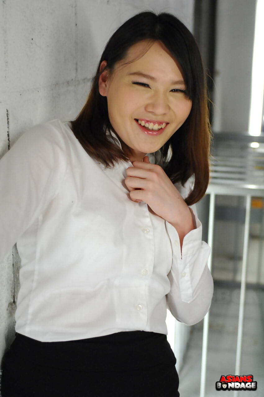 Asian chick Aki Sasahara is fitted with gag in white blouse and black skirt page 1