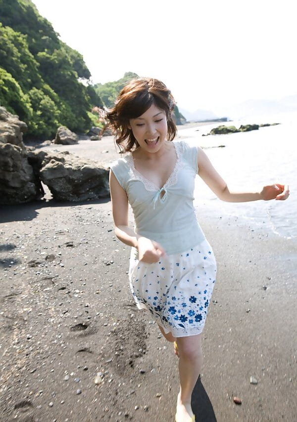 Young Japanese girl Saki Koto exposes her tits and ass at the beach page 1