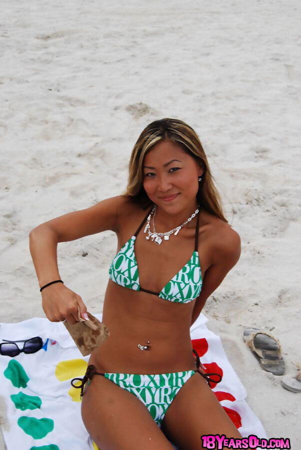 Asian teen babe with tiny tits Tina posing in hot bikini outdoor page 1