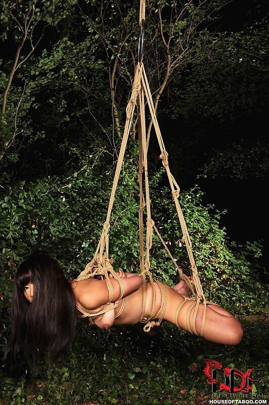 Naked Japanese chick Marica Hase is suspended by rope just outside forest path page 1