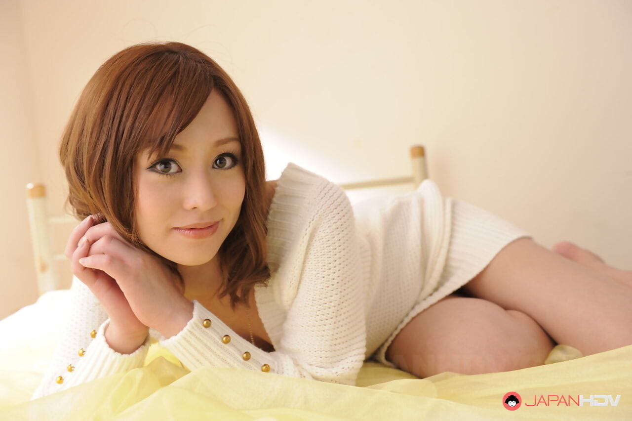Beautiful Japanese girl Miina Yoshihara releases small tits from sweater top page 1