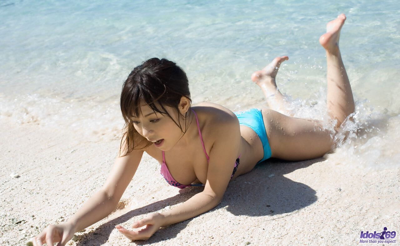 Sexy Japanese girl Aya Hirai gets naked on a tropical beach during solo action page 1