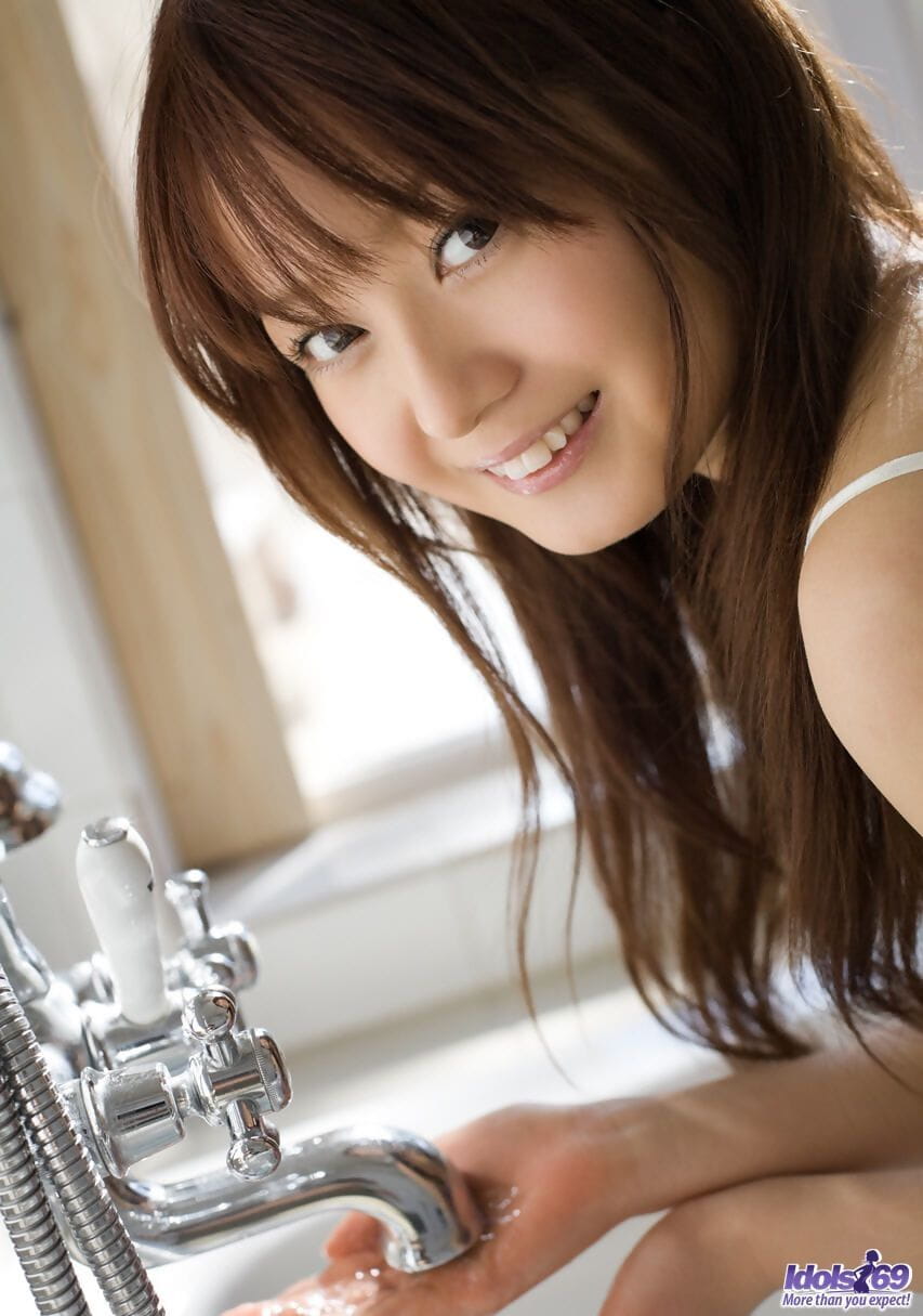 Japanese female Rina removes sensual lingerie before taking a bath page 1