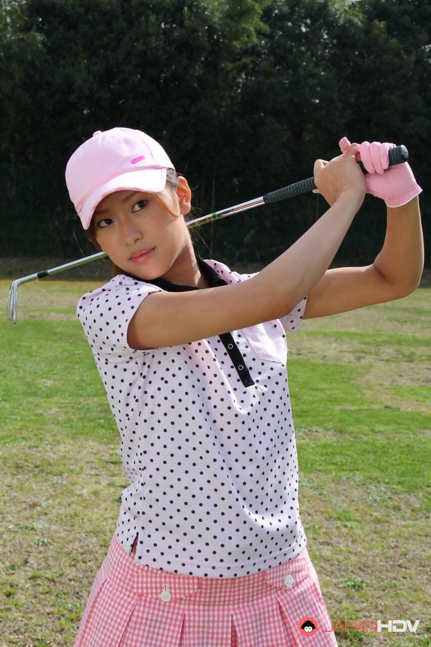 Young Japanese golfer Nao Yuzumiya flashes a no panty up skirt on the course page 1