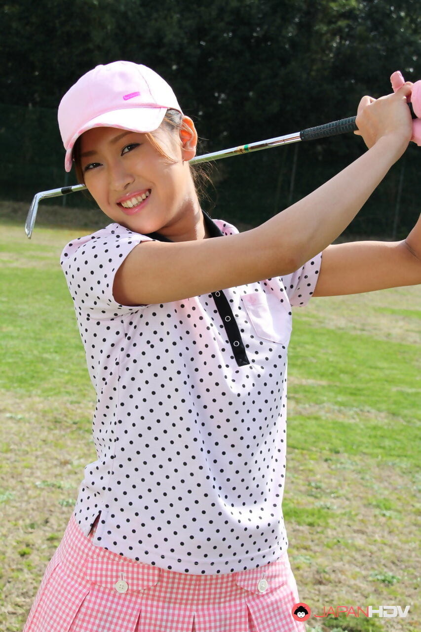 Young Japanese golfer Nao Yuzumiya flashes a no panty up skirt on the course page 1