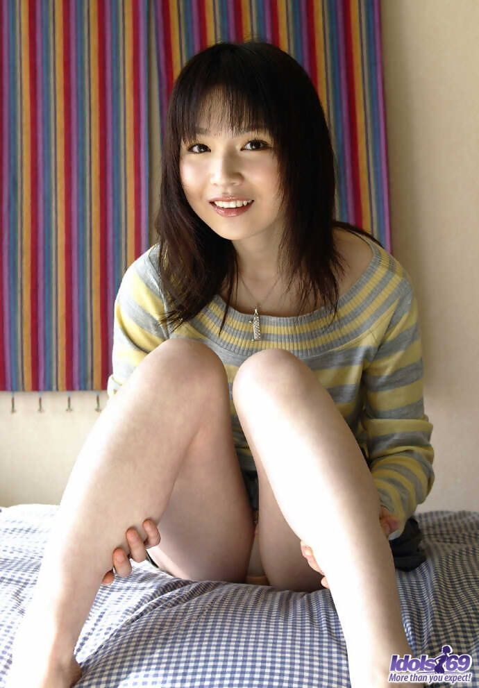Young Japanese girl Kanan Kawaii flashes upskirt panties before getting naked page 1