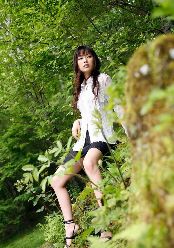 Beautiful Japanese girl Yua Aida exposes her firm tits amid natures beauty page 1