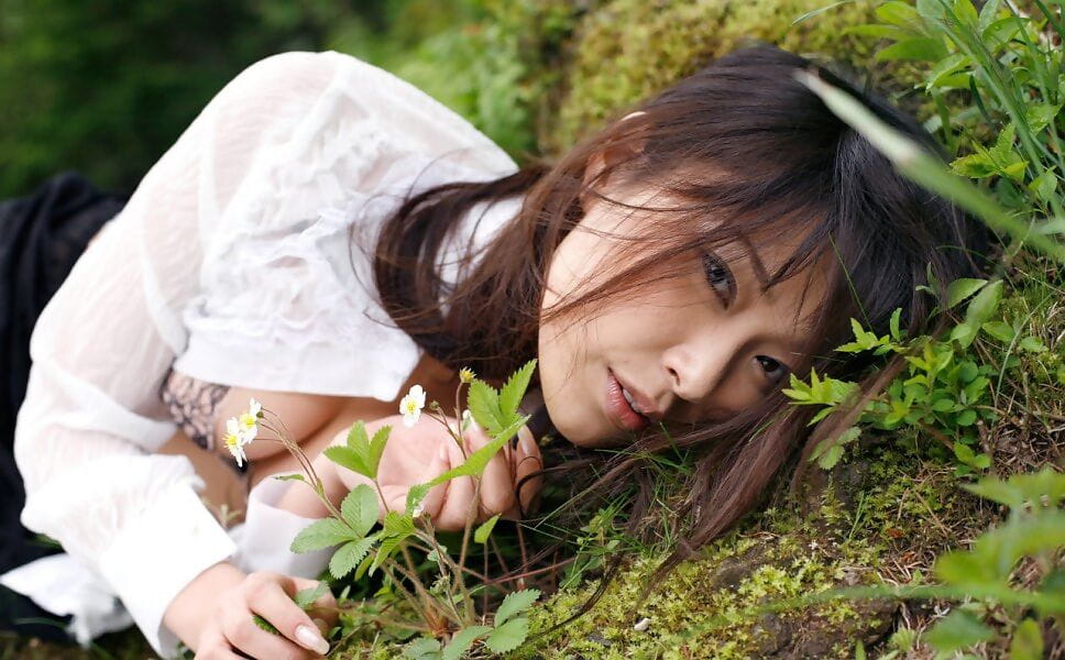 Beautiful Japanese girl Yua Aida exposes her firm tits amid natures beauty page 1