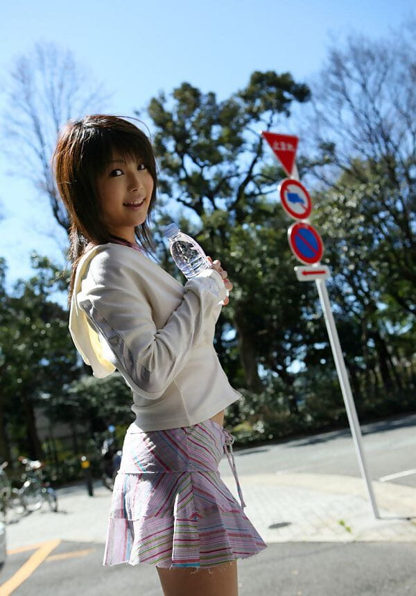 Cute Japanese girl Azumi Harusaki exposes her up skirt panties outdoors page 1