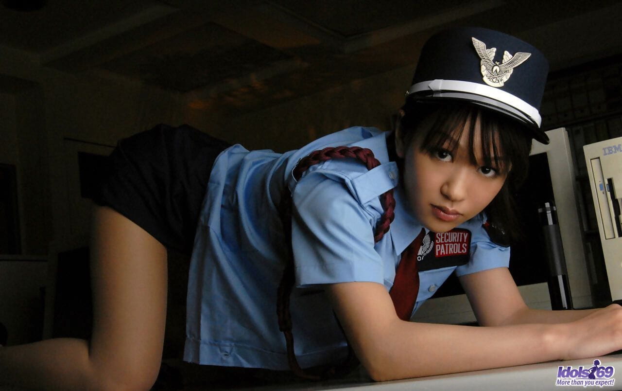 Asian policewoman Riina has her tits fondled while disrobing page 1