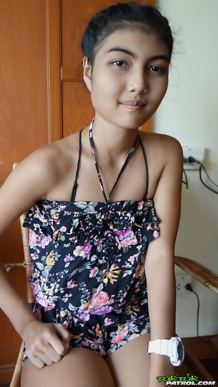 Petite Asian teen Pauw takes off her gown and flaunts her tits and hairy kitty page 1