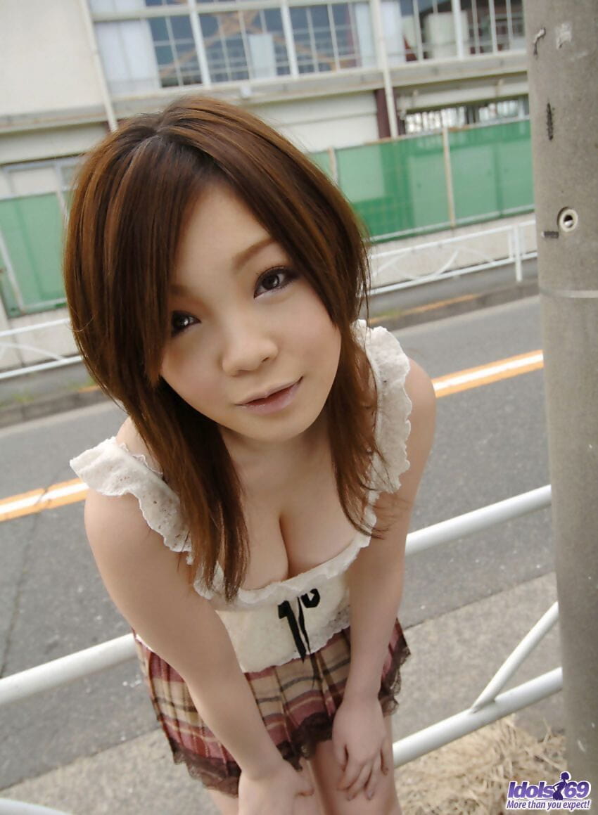 Cute Japanese girl Nami Ogawa flashes upskirt panties outside before disrobing page 1