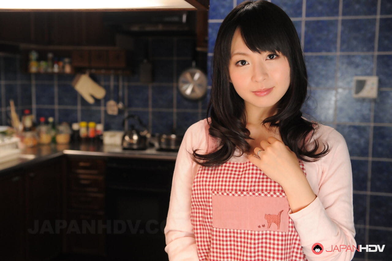 Japanese housewife with a pretty face poses non nude in her kitchen page 1