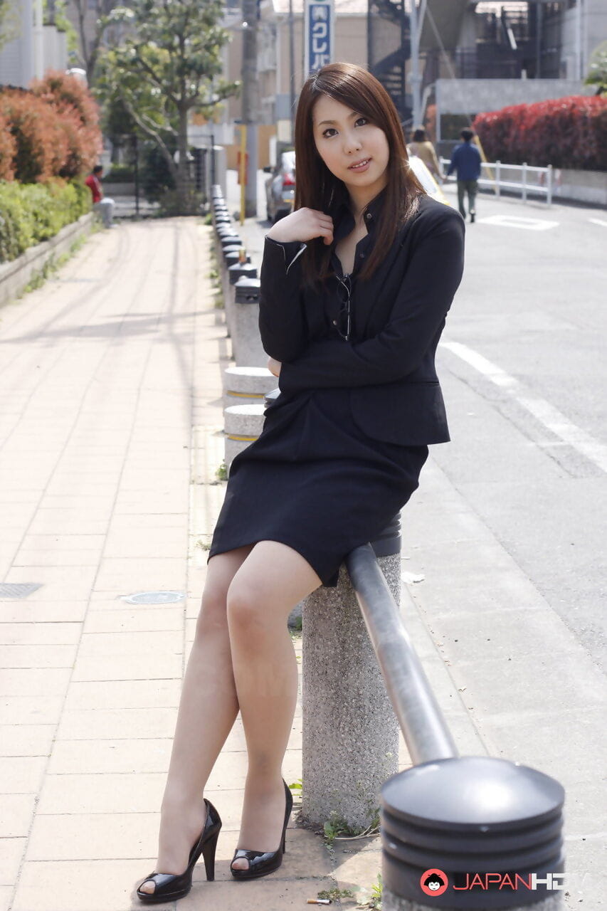 Japanese model Hikaru Matsu takes her glasses on and off in business clothing page 1