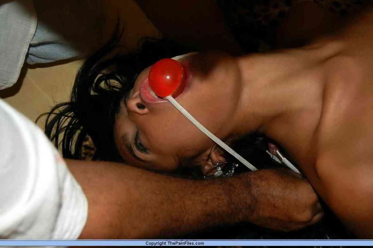 Petite Asian girl is flogged after being roped tied and ball gagged page 1