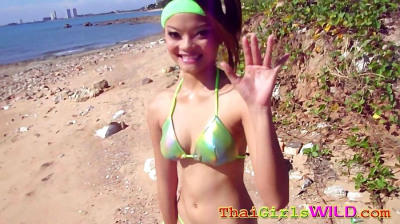 Thailand cutie poses and flashes her goodies at the public beach - part 2288