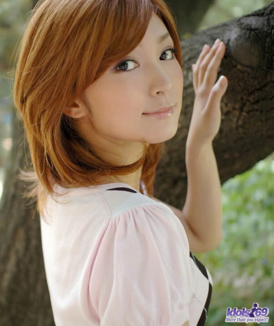Young Japanese girl with red hair shows her upskirt underwear