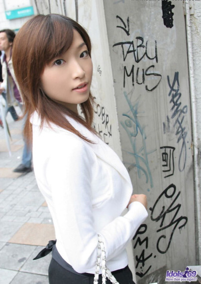 Young Japanese girl Koto sits on a toilet seat after undressing