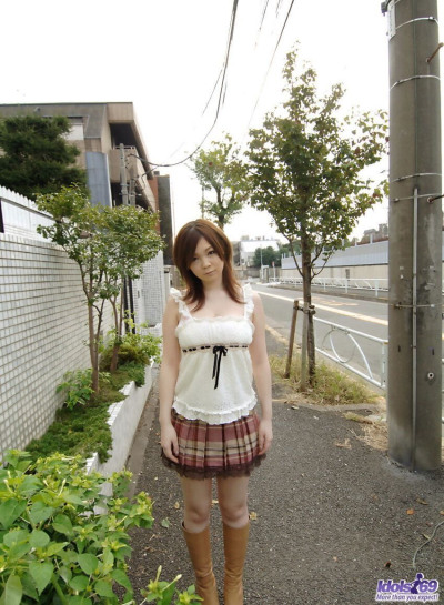 Cute Japanese girl Nami Ogawa flashes upskirt panties outside before disrobing