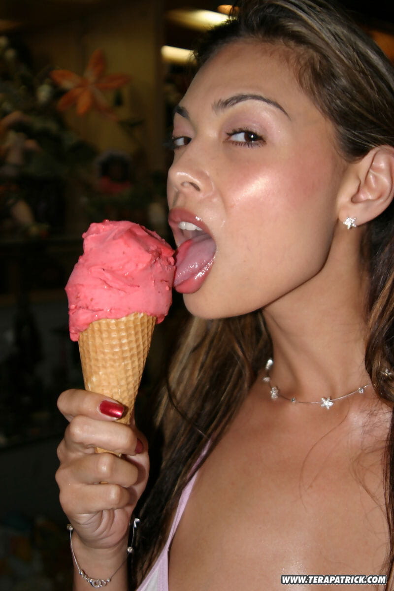 Asian model Tera Patrick licks ice cream cone in white latex boots page 1
