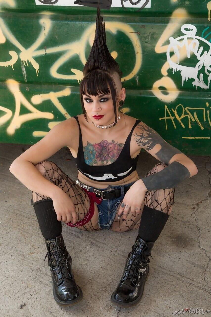 Mohawked punk girl Amelia Dire drops fishnets to spread luscious ass in alley page 1