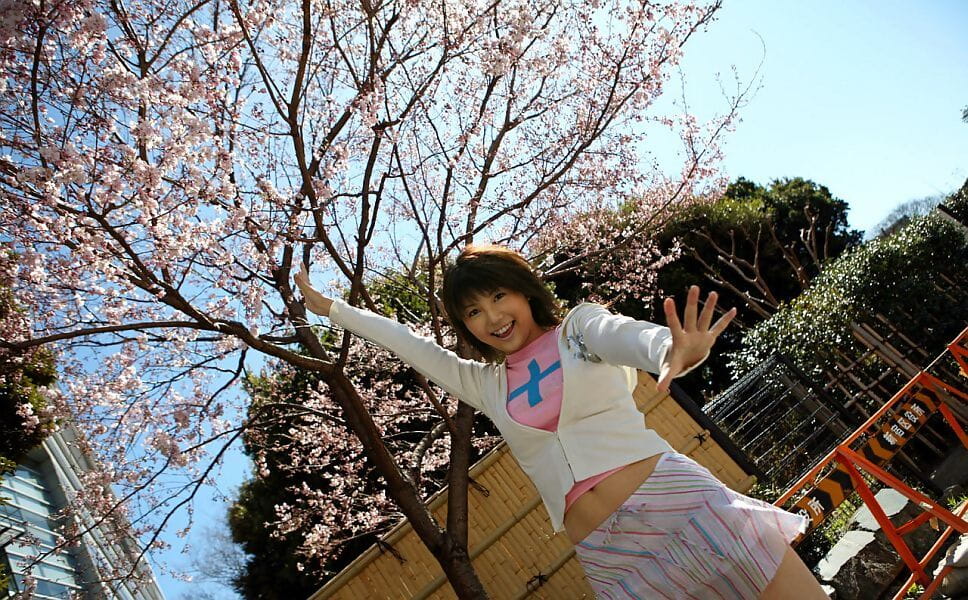 Cute Japanese girl Azumi Harusaki exposes her up skirt panties outdoors page 1