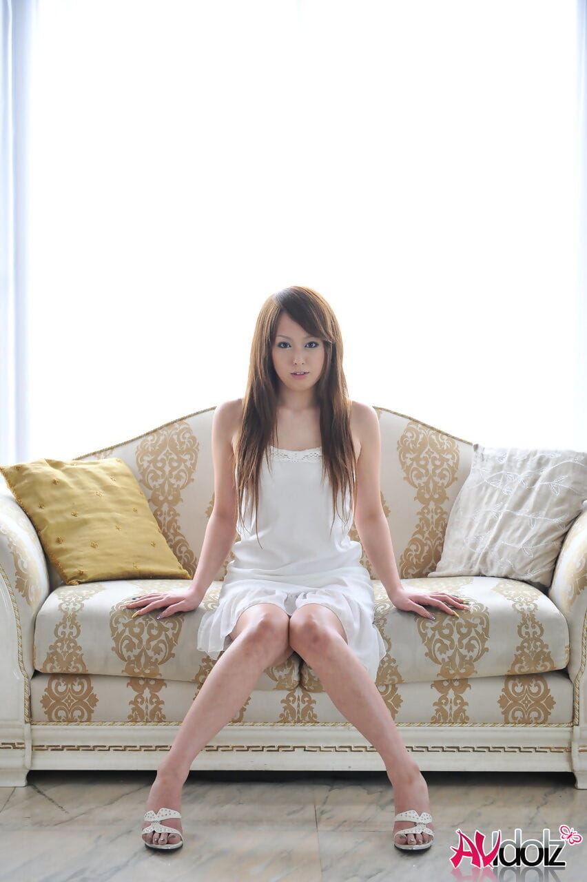 Beautiful Japanese redhead Ichika removes high heeled sandals in white dress page 1
