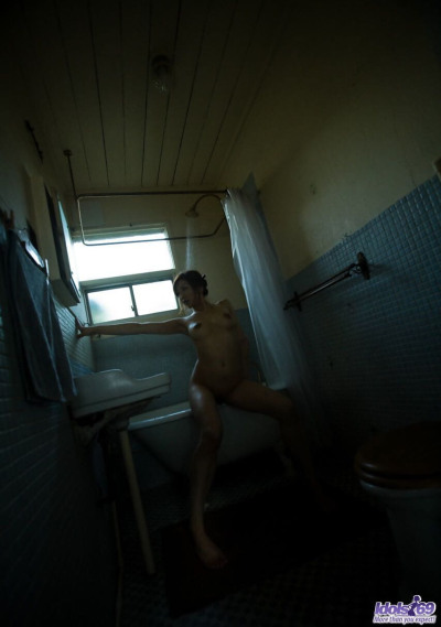 Japanese girl Emi Harukaze displays long nipples after taking a shower