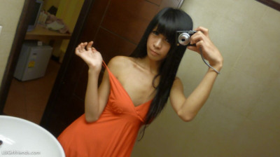 Skinny Asian ladyboys takes mirror selfies while getting undressed